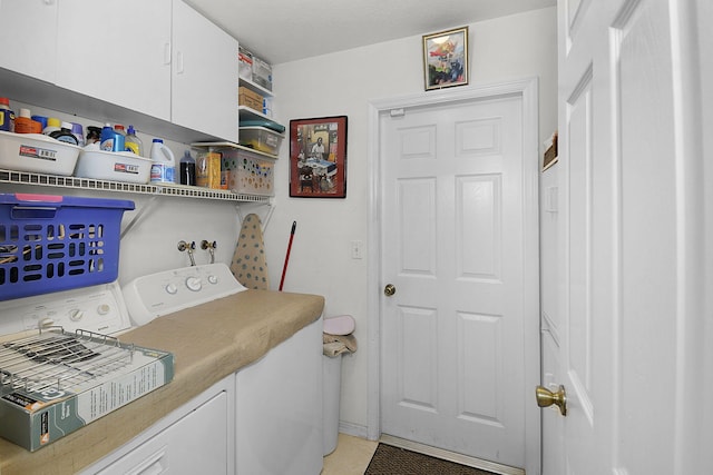 3204 SE Otis Ln, Port Saint Lucie, FL 34984 - laundry room featuring washer and clothes dryer, cabinet space, light tile patterned flooring, and baseboards
