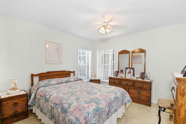 3204 SE Otis Ln, Port Saint Lucie, FL 34984 - bedroom featuring light carpet, ceiling fan, and baseboards