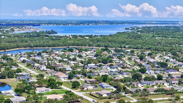3204 SE Otis Ln, Port Saint Lucie, FL 34984 - aerial perspective of suburban area with a nearby body of water