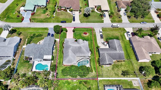 3204 SE Otis Ln, Port Saint Lucie, FL 34984 - aerial perspective of suburban area with property parcel outlined and a pool area