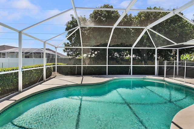 3204 SE Otis Ln, Port Saint Lucie, FL 34984 - view of pool with a fenced backyard, a patio area, and a lanai