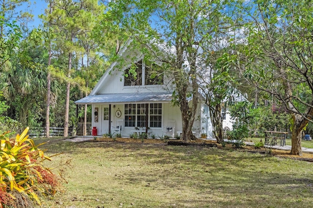 12389 186th St N, Jupiter, FL 33478 - view of front of property featuring covered porch and metal roof