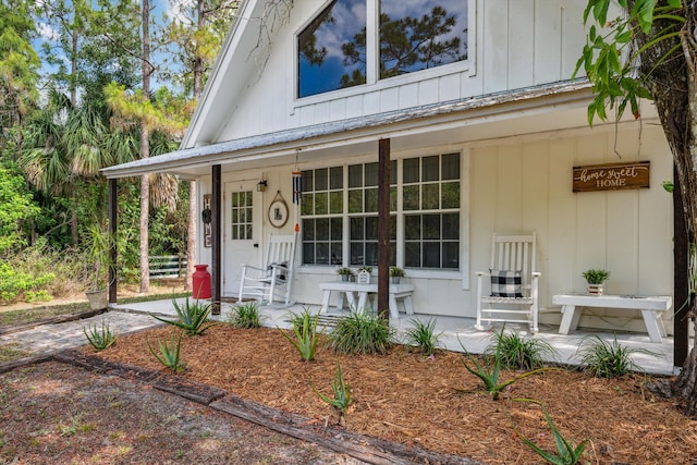 12389 186th St N, Jupiter, FL 33478 - entrance to property featuring covered porch and board and batten siding