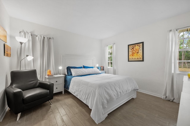 12389 186th St N, Jupiter, FL 33478 - bedroom featuring dark wood finished floors and baseboards