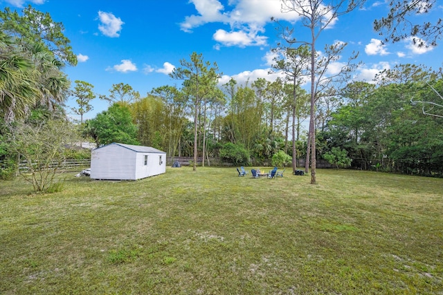 12389 186th St N, Jupiter, FL 33478 - view of yard with an outbuilding, a storage shed, and view of wooded area