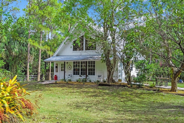 12389 186th St N, Jupiter, FL 33478 - view of front of property with a porch and metal roof
