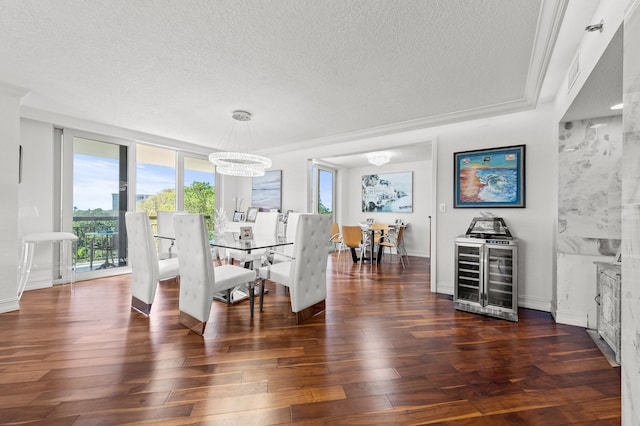 901 E Camino Real Unit 5C, Boca Raton, FL 33432 - dining area with beverage cooler, a textured ceiling, dark wood finished floors, a chandelier, and baseboards