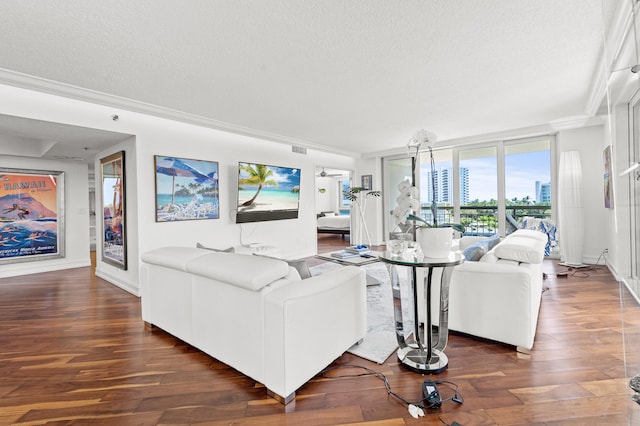 901 E Camino Real Unit 5C, Boca Raton, FL 33432 - living room with a textured ceiling, dark wood-style flooring, ornamental molding, and baseboards