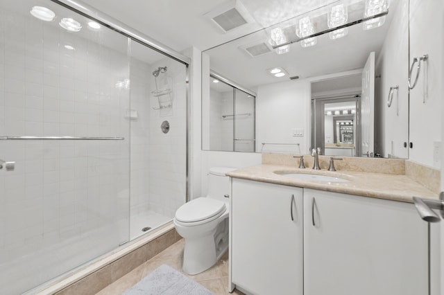 901 E Camino Real Unit 5C, Boca Raton, FL 33432 - full bath with a stall shower, toilet, tile patterned floors, and vanity