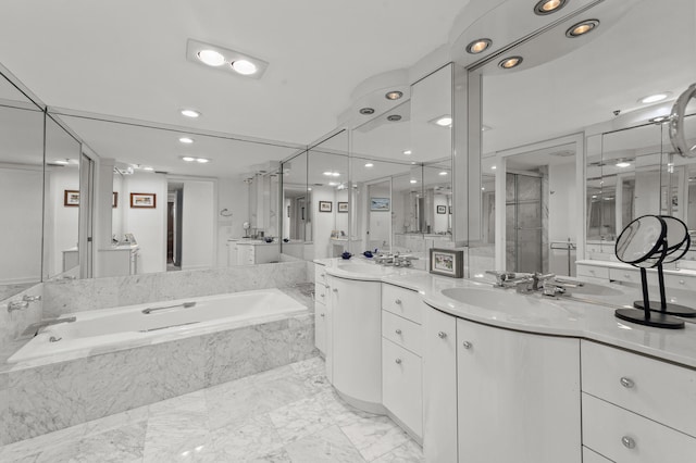 901 E Camino Real Unit 5C, Boca Raton, FL 33432 - bathroom with a garden tub, recessed lighting, a shower stall, and vanity