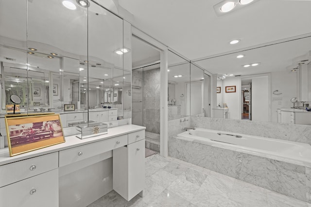 901 E Camino Real Unit 5C, Boca Raton, FL 33432 - full bath featuring a bath, a walk in shower, vanity, and recessed lighting