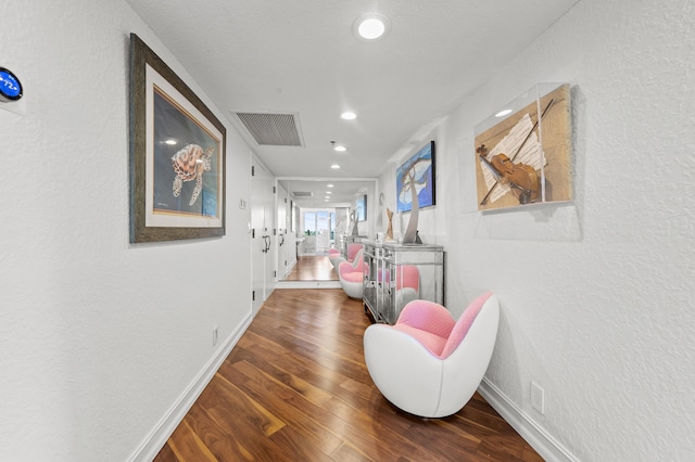 901 E Camino Real Unit 5C, Boca Raton, FL 33432 - hall featuring recessed lighting, wood finished floors, a textured wall, and baseboards