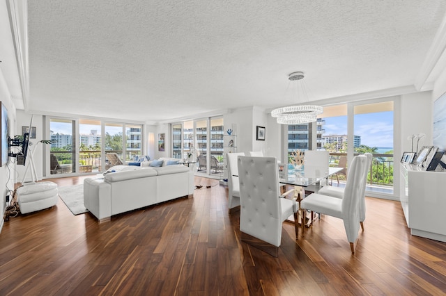 901 E Camino Real Unit 5C, Boca Raton, FL 33432 - dining room with a textured ceiling, a wall of windows, dark wood finished floors, a view of city, and ornamental molding