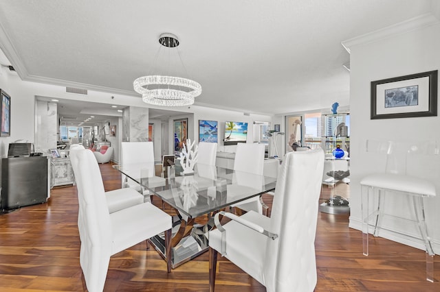 901 E Camino Real Unit 5C, Boca Raton, FL 33432 - dining area with wood finished floors, a chandelier, and crown molding