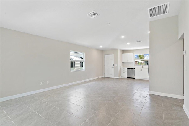 15 Jacaranda Ln, Port Saint Lucie, FL 34952 - unfurnished living room featuring recessed lighting, light tile patterned floors, and baseboards