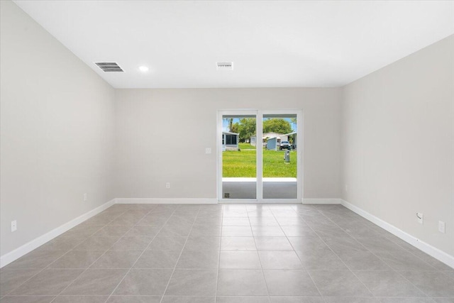 15 Jacaranda Ln, Port Saint Lucie, FL 34952 - unfurnished room with light tile patterned floors, baseboards, and recessed lighting