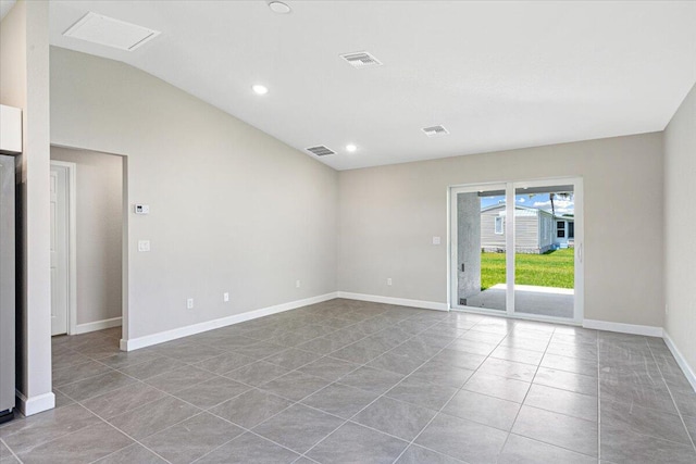 15 Jacaranda Ln, Port Saint Lucie, FL 34952 - tiled spare room with vaulted ceiling, baseboards, and recessed lighting
