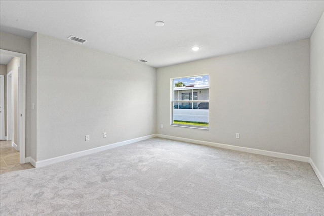 15 Jacaranda Ln, Port Saint Lucie, FL 34952 - carpeted spare room with baseboards and recessed lighting