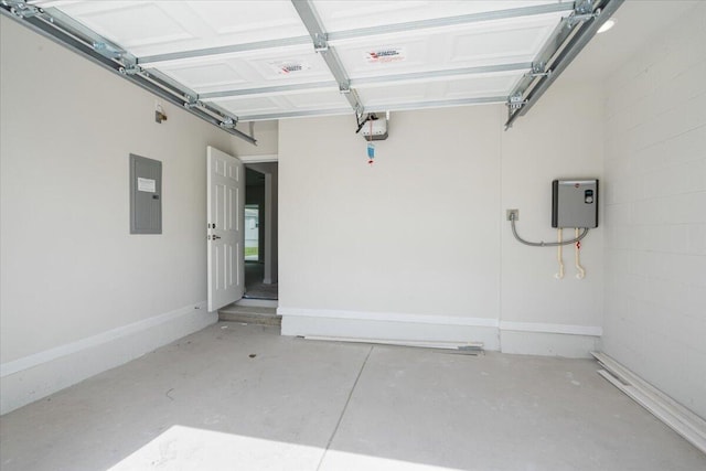 garage with electric panel and a garage door opener