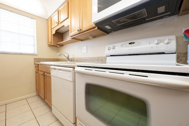 915 Savannas Point Dr Unit E, Fort Pierce, FL 34950 - kitchen with white appliances, light countertops, light tile patterned floors, a sink, and light brown cabinetry