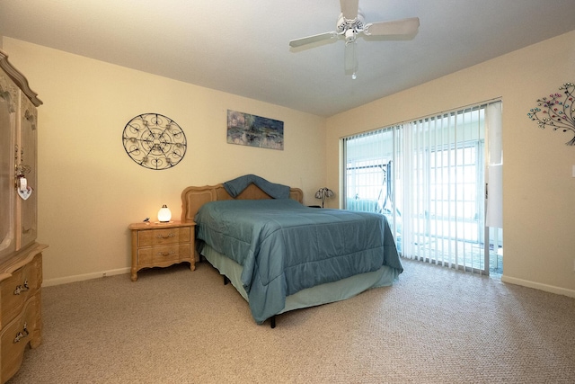 915 Savannas Point Dr Unit E, Fort Pierce, FL 34950 - bedroom featuring baseboards, light carpet, access to outside, and a ceiling fan