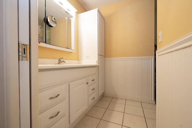915 Savannas Point Dr Unit E, Fort Pierce, FL 34950 - bathroom with a wainscoted wall, vanity, and tile patterned flooring