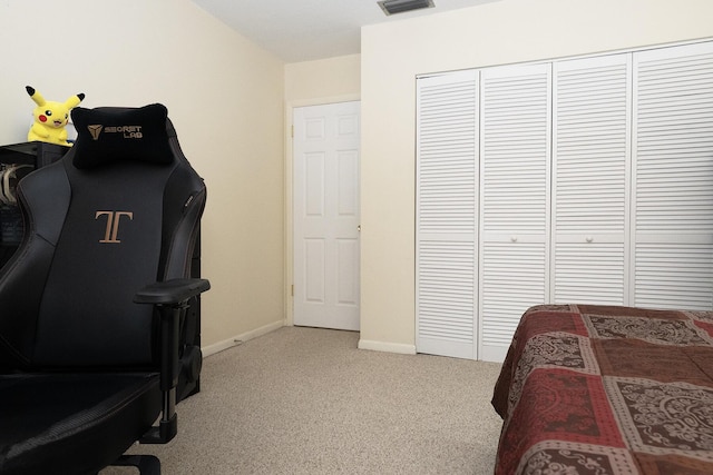 915 Savannas Point Dr Unit E, Fort Pierce, FL 34950 - bedroom featuring light colored carpet, a closet, and baseboards