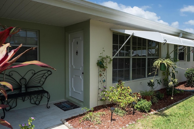 915 Savannas Point Dr Unit E, Fort Pierce, FL 34950 - property entrance with stucco siding