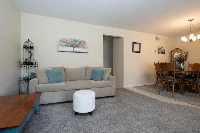 915 Savannas Point Dr Unit E, Fort Pierce, FL 34950 - tiled living room featuring a chandelier and carpet floors