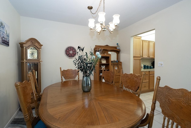 915 Savannas Point Dr Unit E, Fort Pierce, FL 34950 - dining room featuring a chandelier and light tile patterned floors