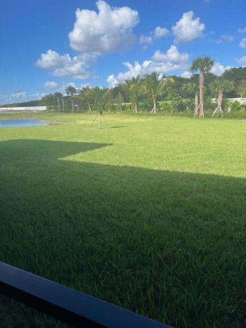 view of grassy yard with a water view