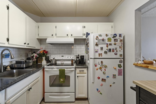 kitchen with white appliances, exhaust hood, a sink, tasteful backsplash, and white cabinets