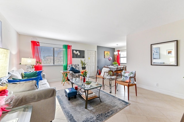 living area with light tile patterned floors and baseboards