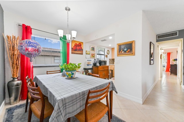 dining area with a chandelier, baseboards, light tile patterned flooring, and recessed lighting