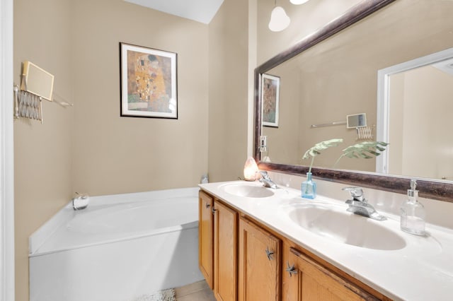 full bath featuring a garden tub, double vanity, and tile patterned flooring