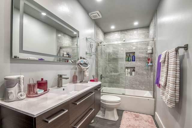 full bath with vanity, toilet, combined bath / shower with glass door, tile patterned flooring, and recessed lighting