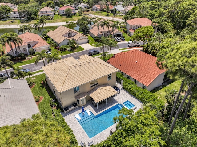 aerial perspective of suburban area featuring a pool area
