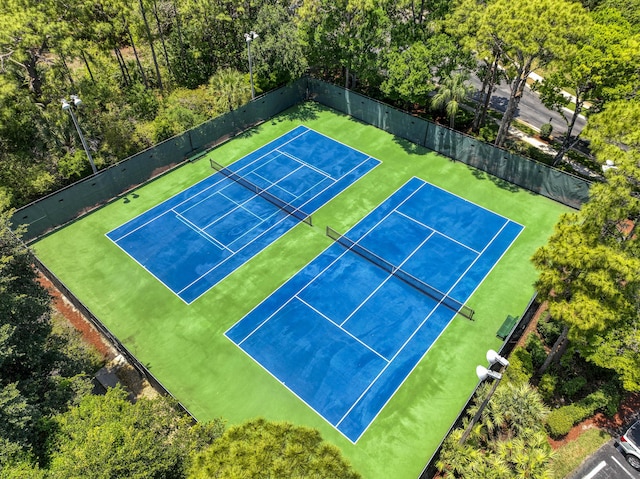view of tennis court with fence