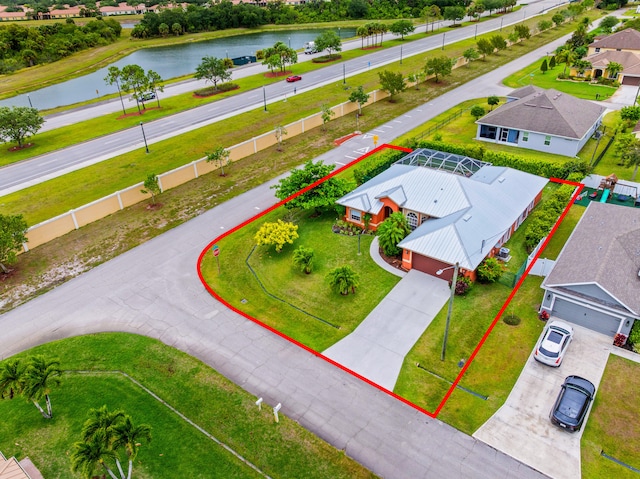 1601 SW Realty St, Port Saint Lucie, FL 34987 - aerial perspective of suburban area with a large body of water and property parcel outlined