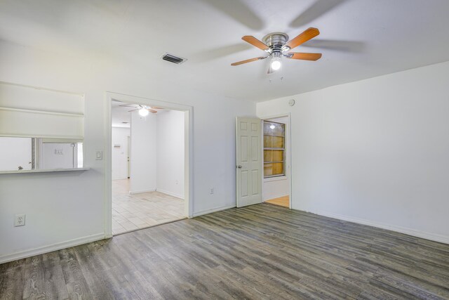 280 NW Airoso Blvd, Port Saint Lucie, FL 34983 - unfurnished room with a ceiling fan, wood finished floors, and baseboards
