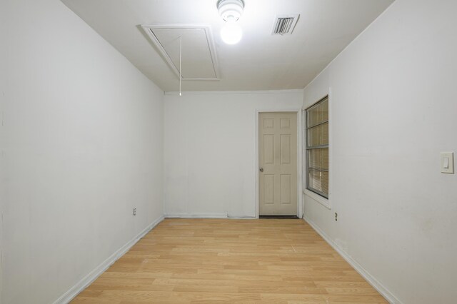 280 NW Airoso Blvd, Port Saint Lucie, FL 34983 - unfurnished room featuring attic access, light wood-style flooring, and baseboards