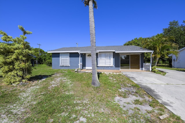 280 NW Airoso Blvd, Port Saint Lucie, FL 34983 - ranch-style home featuring a front yard and driveway