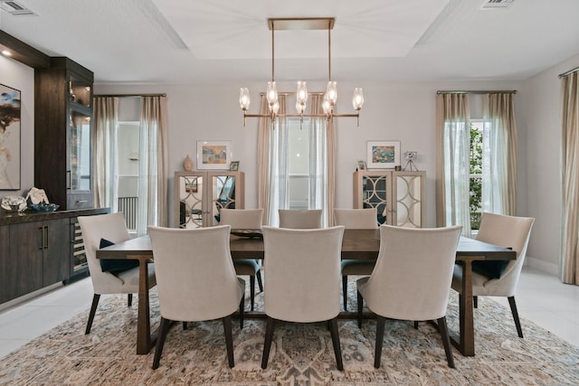 6028 Curie Pl, Palm Beach Gardens, FL 33418 - dining area featuring a chandelier and light tile patterned flooring
