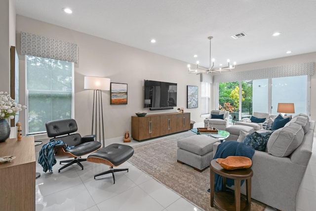 6028 Curie Pl, Palm Beach Gardens, FL 33418 - tiled living area with a chandelier and recessed lighting