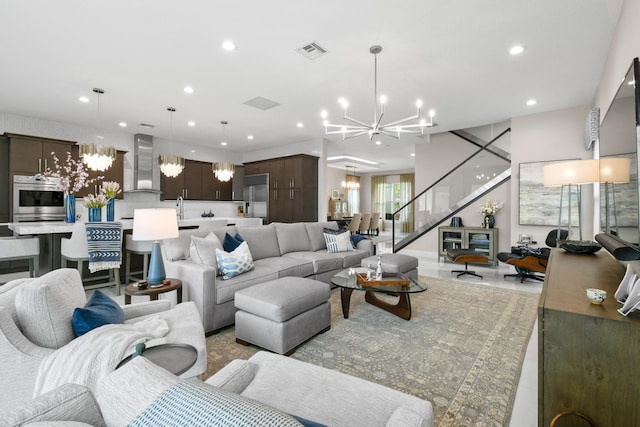 6028 Curie Pl, Palm Beach Gardens, FL 33418 - living room featuring a chandelier and recessed lighting
