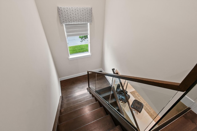 6028 Curie Pl, Palm Beach Gardens, FL 33418 - staircase with baseboards and wood finished floors