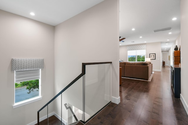 6028 Curie Pl, Palm Beach Gardens, FL 33418 - hallway with an upstairs landing, dark wood-style floors, recessed lighting, and baseboards