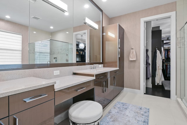 6028 Curie Pl, Palm Beach Gardens, FL 33418 - full bath with a stall shower, a spacious closet, vanity, and tile patterned floors
