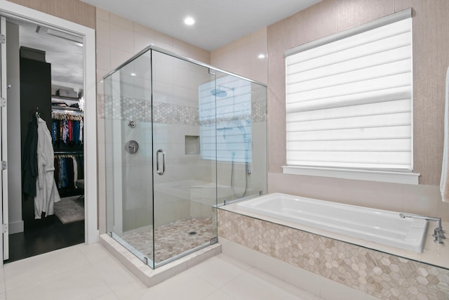 6028 Curie Pl, Palm Beach Gardens, FL 33418 - full bath with a garden tub, a shower stall, tile patterned flooring, a walk in closet, and recessed lighting