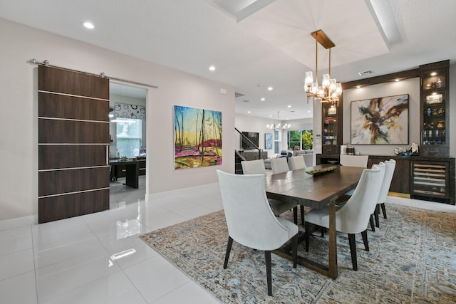 6028 Curie Pl, Palm Beach Gardens, FL 33418 - dining room with a chandelier, wine cooler, tile patterned flooring, recessed lighting, and baseboards
